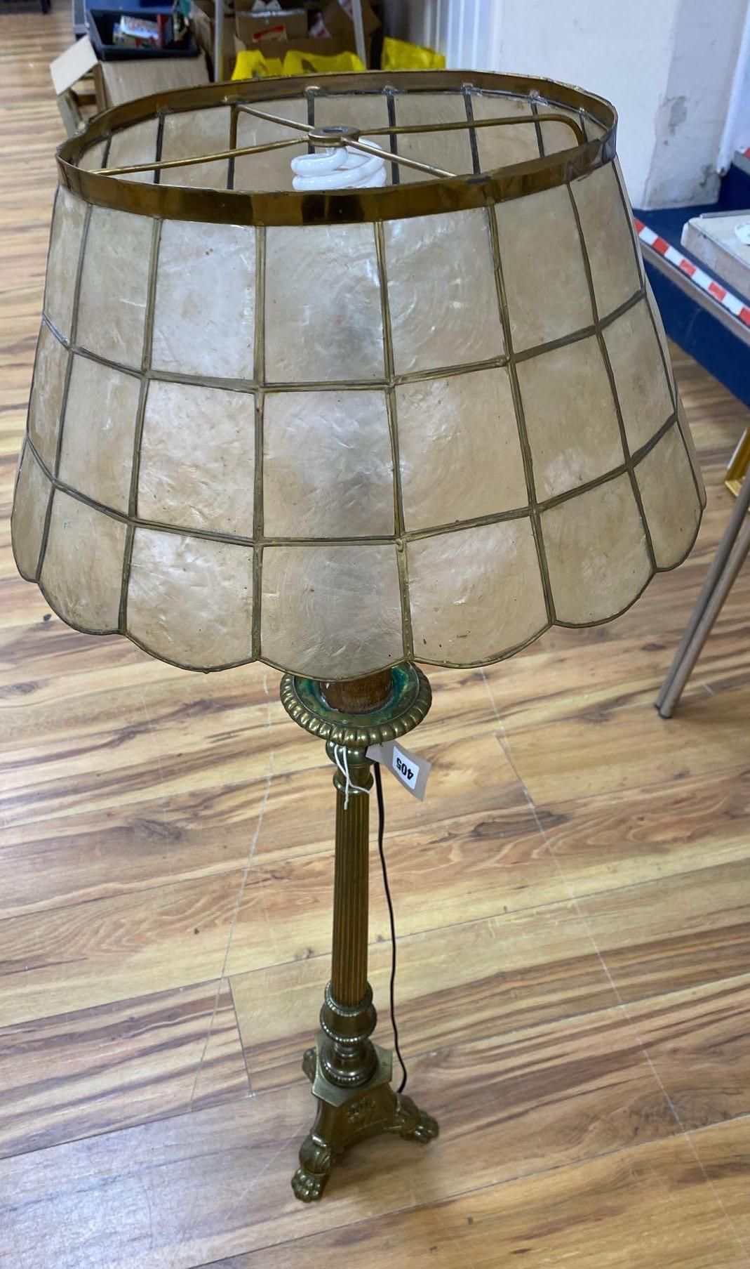 A brass column lamp and a brass standard lamp on three paw feet (with shades)